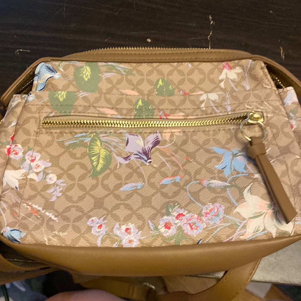 Purse with flowers all over it